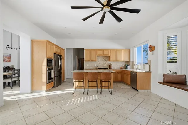 a dining room with furniture and a kitchen