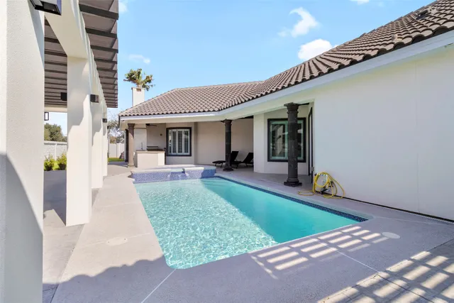 a view of a house with backyard and porch