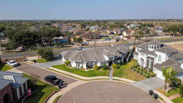 an aerial view of residential houses with outdoor space