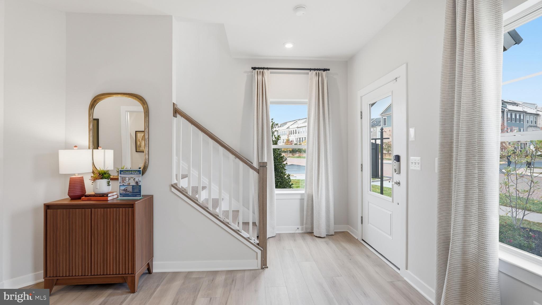 17397 Walnut Grove Way Dumfries, VA 22026 - Photo 14 of 51 a view of an entryway with wooden floor