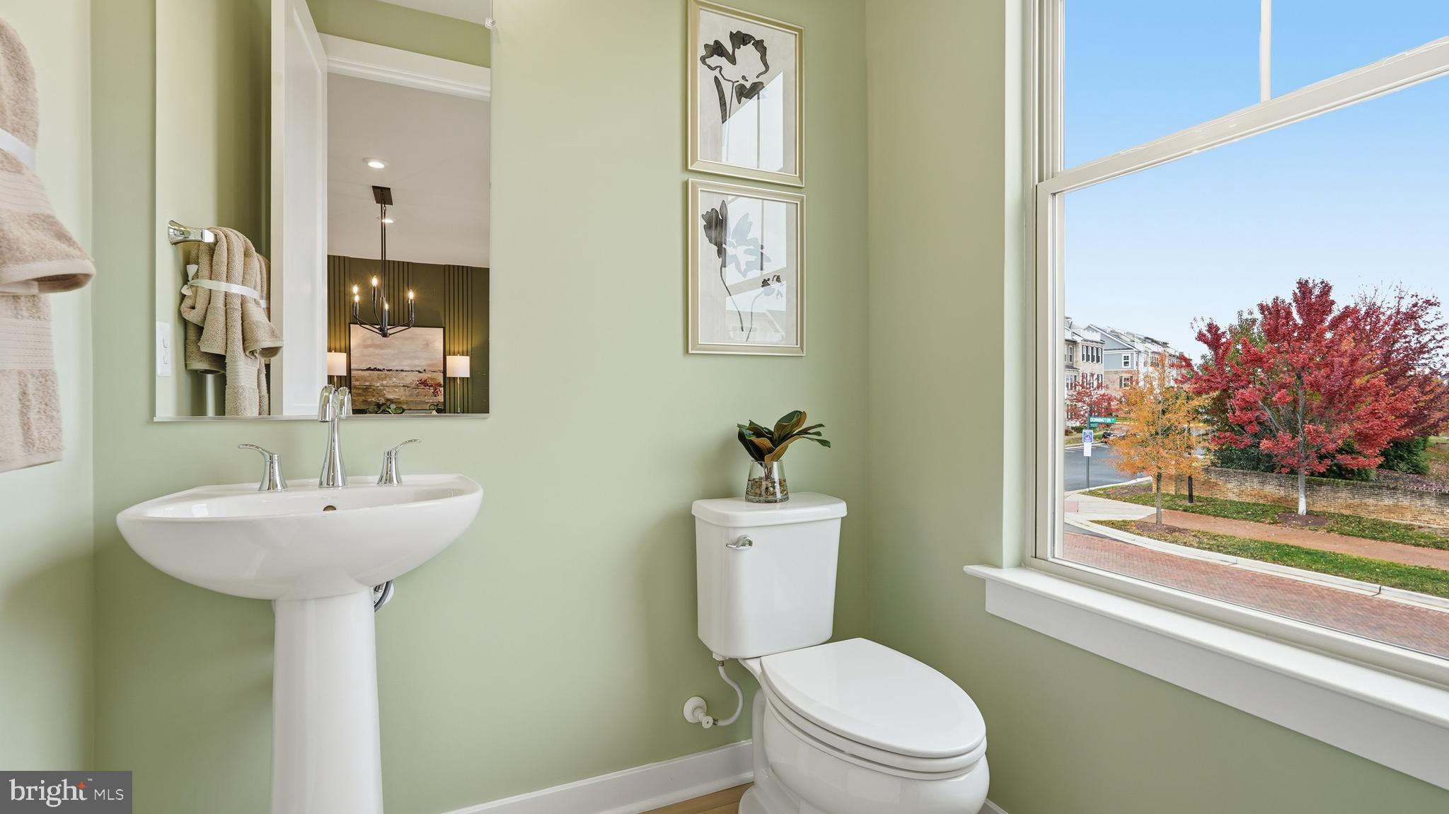 17397 Walnut Grove Way Dumfries, VA 22026 - Photo 23 of 51 a bathroom with a sink mirror toilet and next to a window