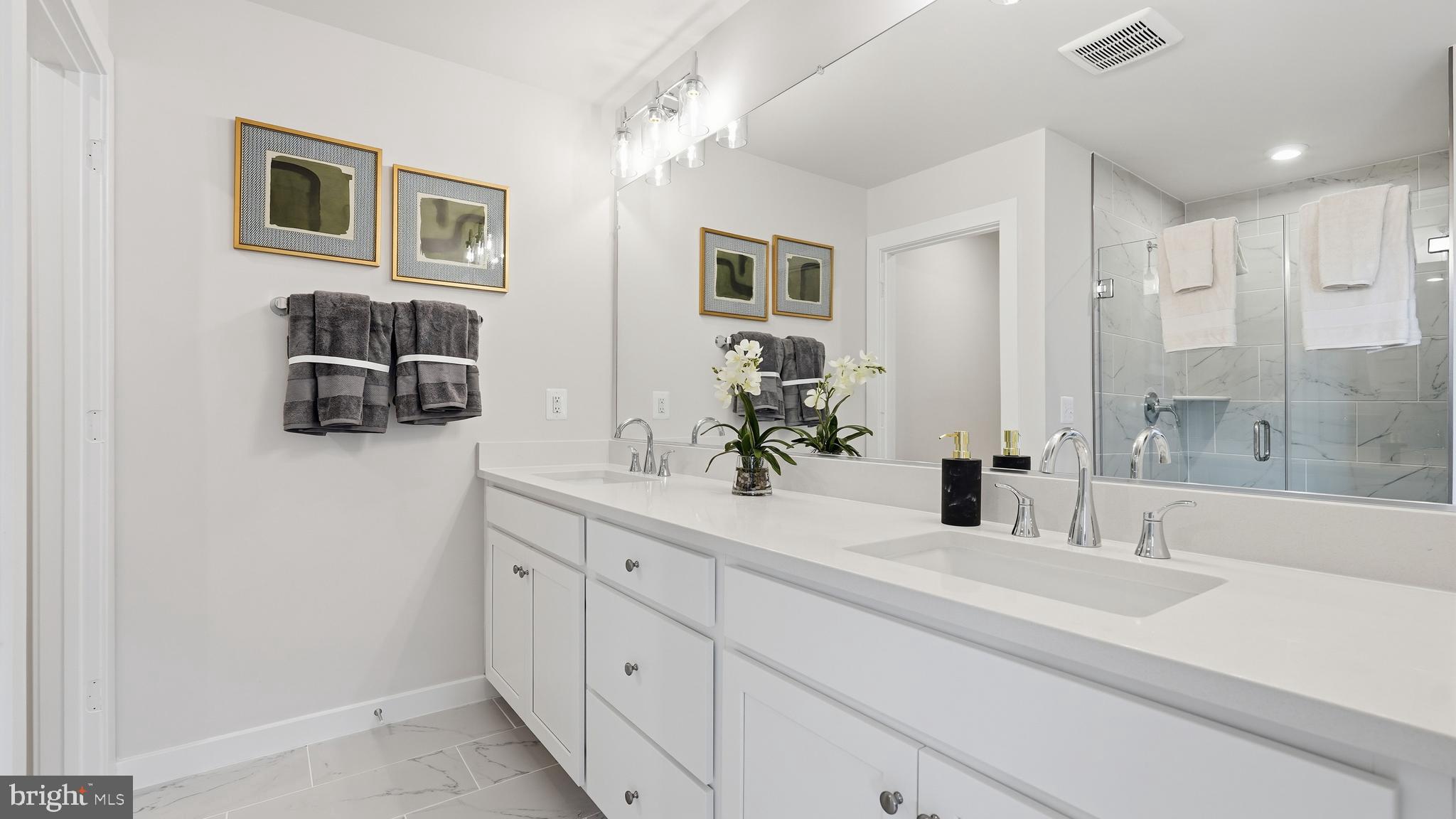 17397 Walnut Grove Way Dumfries, VA 22026 - Photo 26 of 51 a bathroom with a sink and a mirror