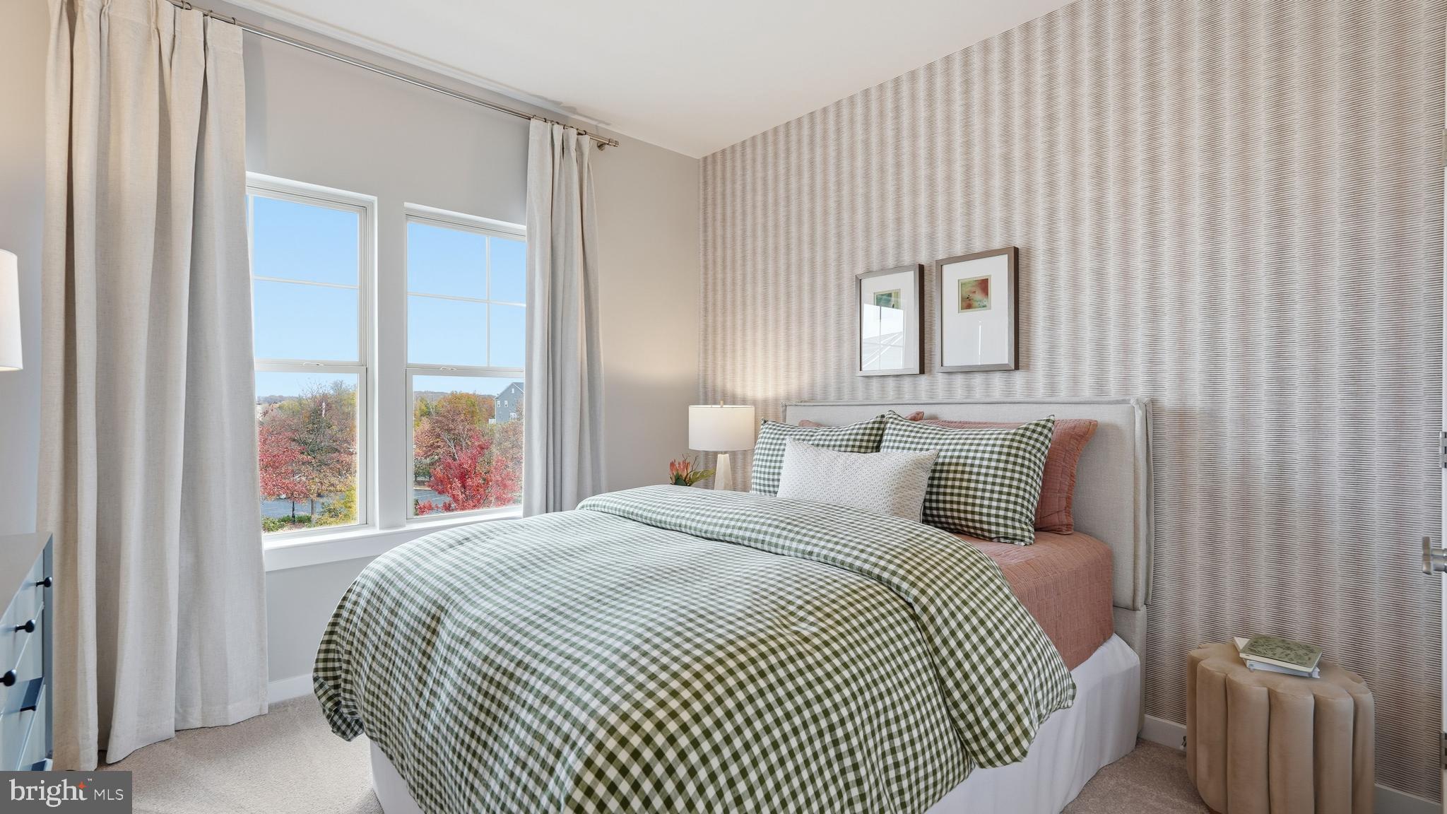 17397 Walnut Grove Way Dumfries, VA 22026 - Photo 29 of 51 a bedroom with a large bed and a large window