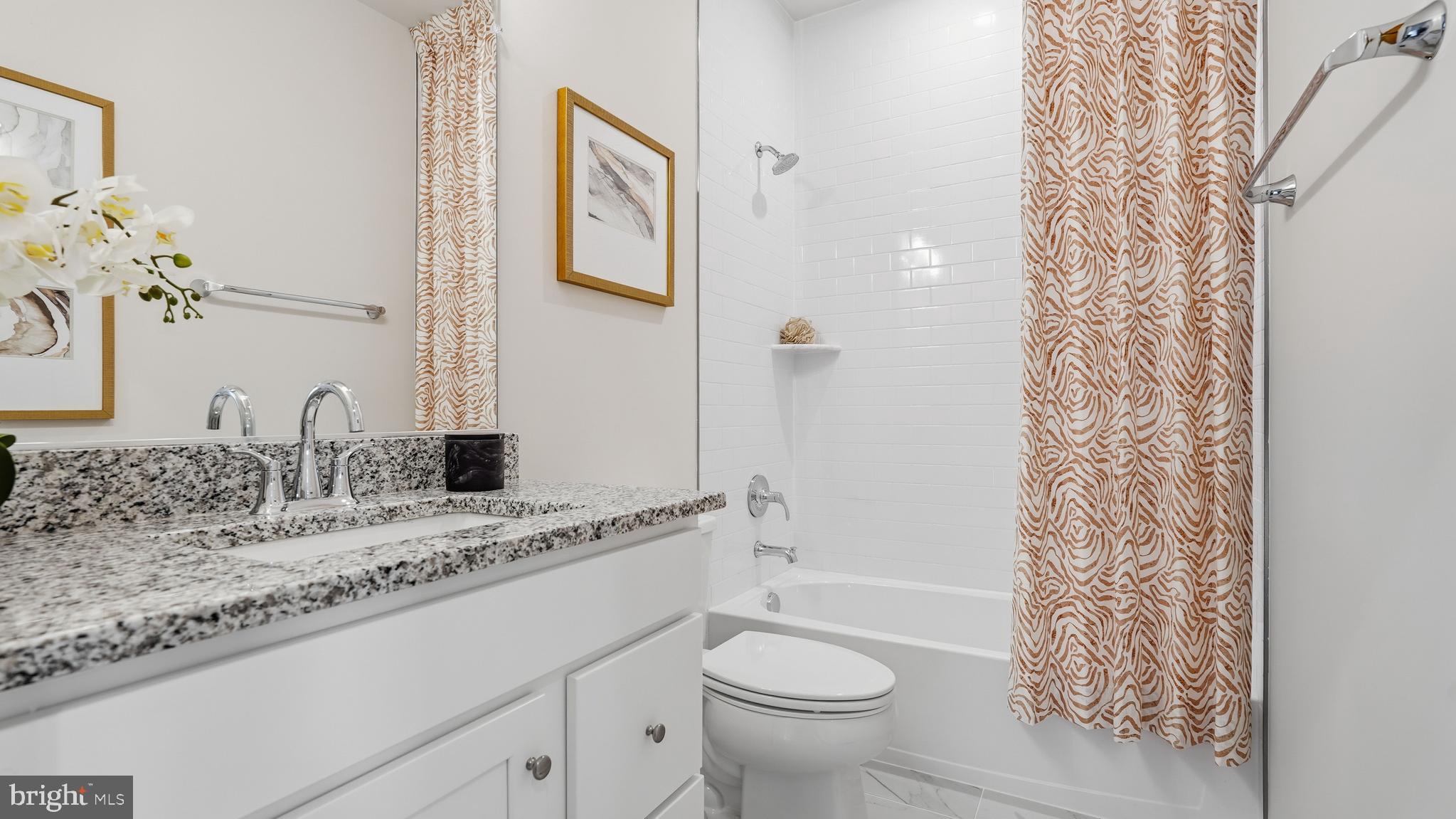 17397 Walnut Grove Way Dumfries, VA 22026 - Photo 32 of 51 a bathroom with a granite countertop sink a toilet and shower