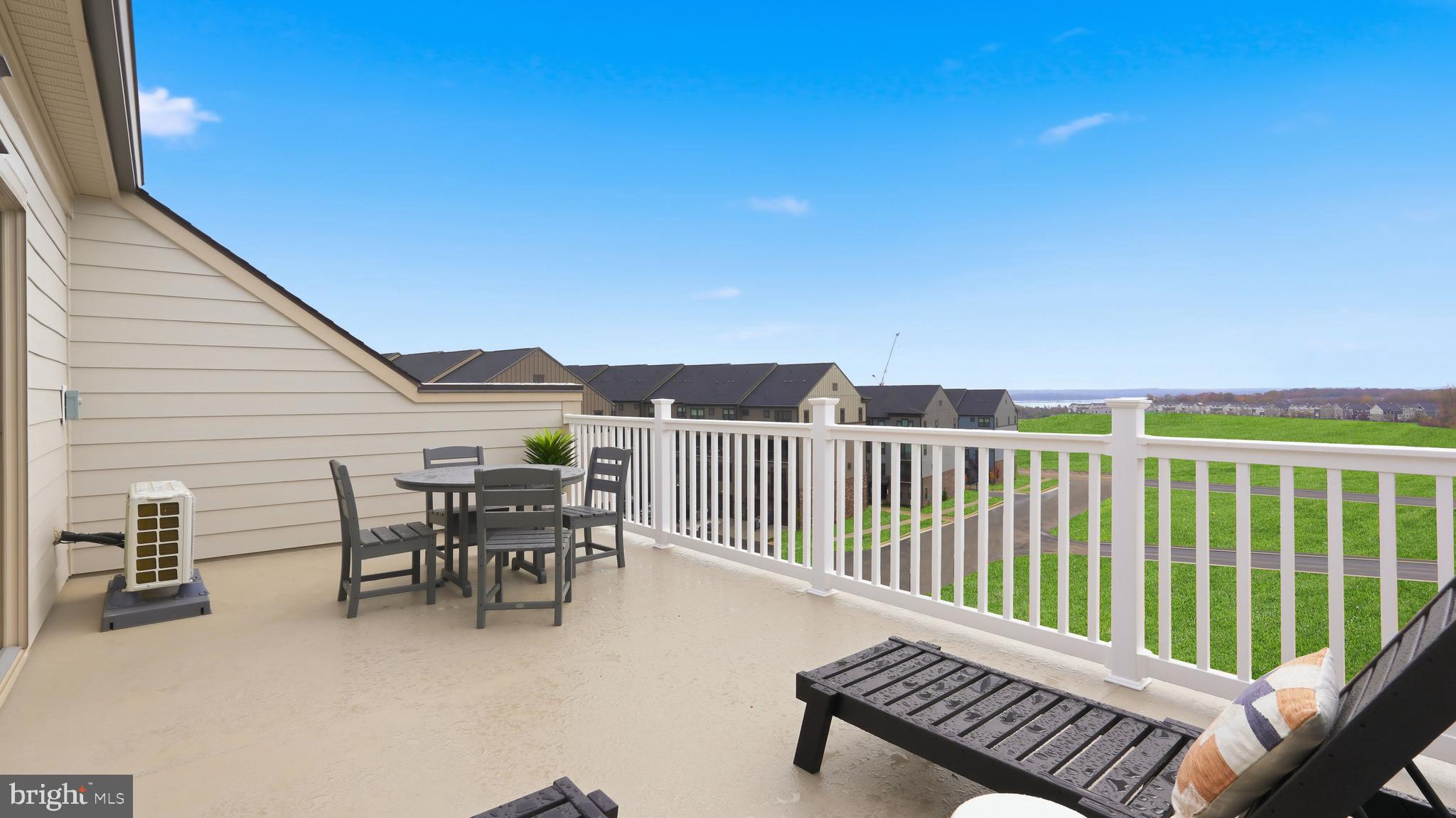 17397 Walnut Grove Way Dumfries, VA 22026 - Photo 36 of 51 a balcony with table and chairs