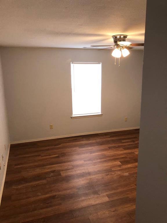 221 Addison Street Lake Dallas, TX 75065 - Photo 5 of 13 a view of a room that has a window in it