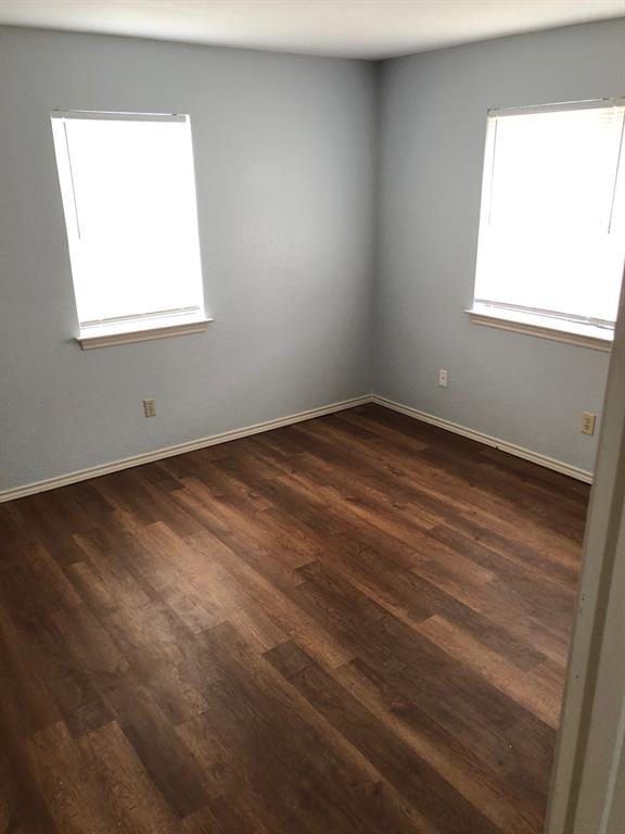 221 Addison Street Lake Dallas, TX 75065 - Photo 9 of 12 an empty room with a window