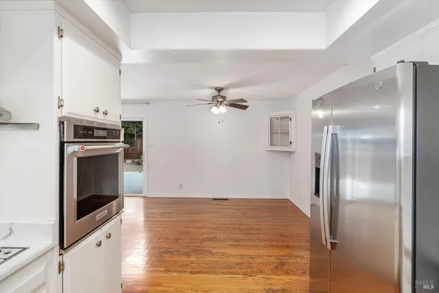 a kitchen with a sink stove and refrigerator