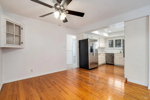a kitchen with stainless steel appliances a refrigerator and a sink
