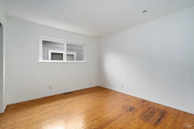 a bathroom with a sink a mirror a toilet and a bathtub