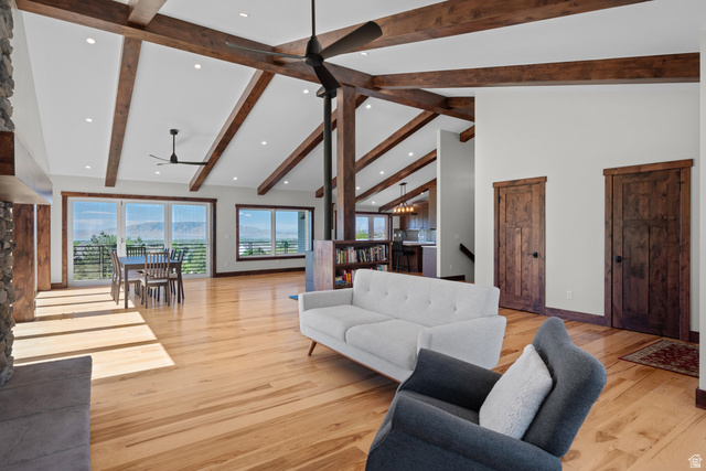 4221 Juniper Circle Alpine, UT 84004 - Photo 8 of 66 Open-concept living area featuring exposed wood beams, vaulted ceilings, recessed lighting, and light wood-finish flooring