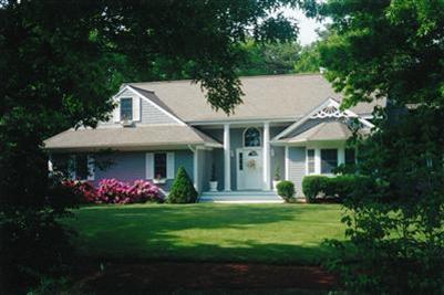 47 Cairn Ridge Road East Falmouth, MA 02536 - Photo 2 of 19 a front view of a house with garden