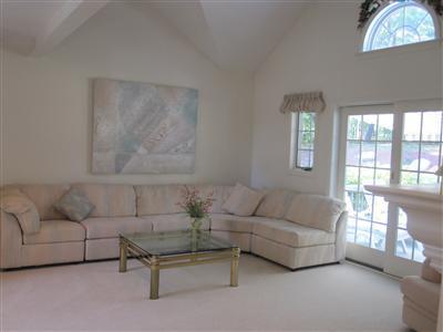 47 Cairn Ridge Road East Falmouth, MA 02536 - Photo 7 of 19 a living room with furniture and a floor to ceiling window