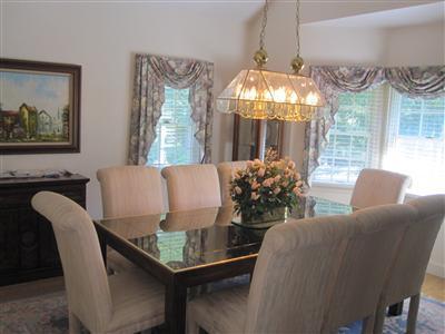 47 Cairn Ridge Road East Falmouth, MA 02536 - Photo 9 of 19 a dining room with furniture and chandelier