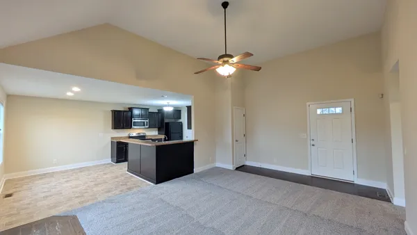 a kitchen with a stove a sink and a refrigerator