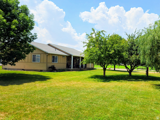 802 East 3200 Road North Preston, ID 83263 - Photo 20 of 59 Expansive green lawn with mature trees, providing natural shade