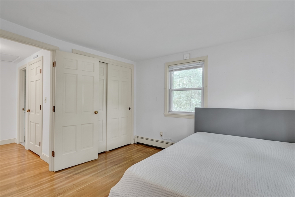 32 Dewey Road Lexington, MA 02420 - Photo 24 of 32 a bedroom with a bed and a window