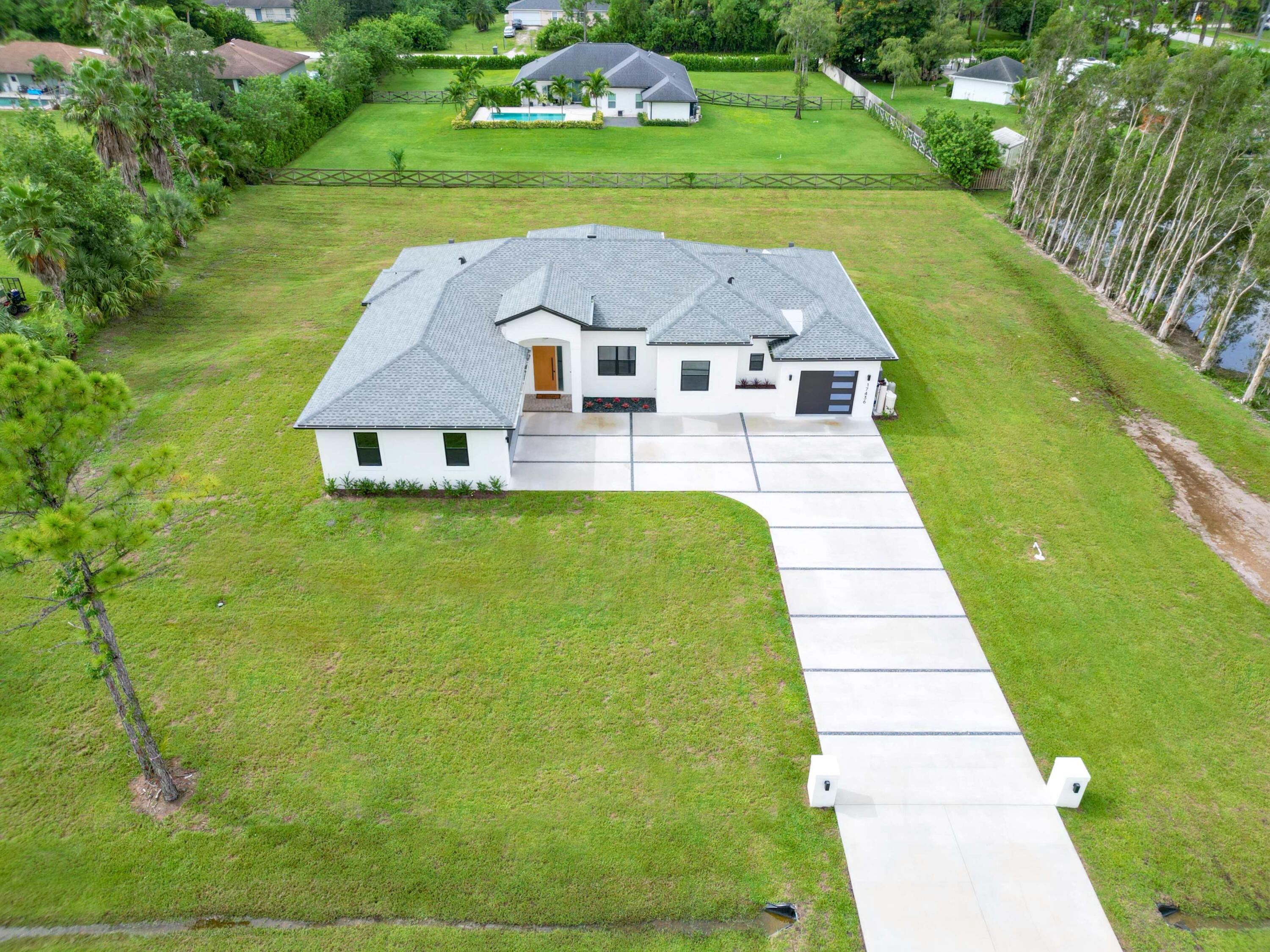 17436 71st Lane North Loxahatchee, FL 33470 - Photo 6 of 50 an aerial view of a house
