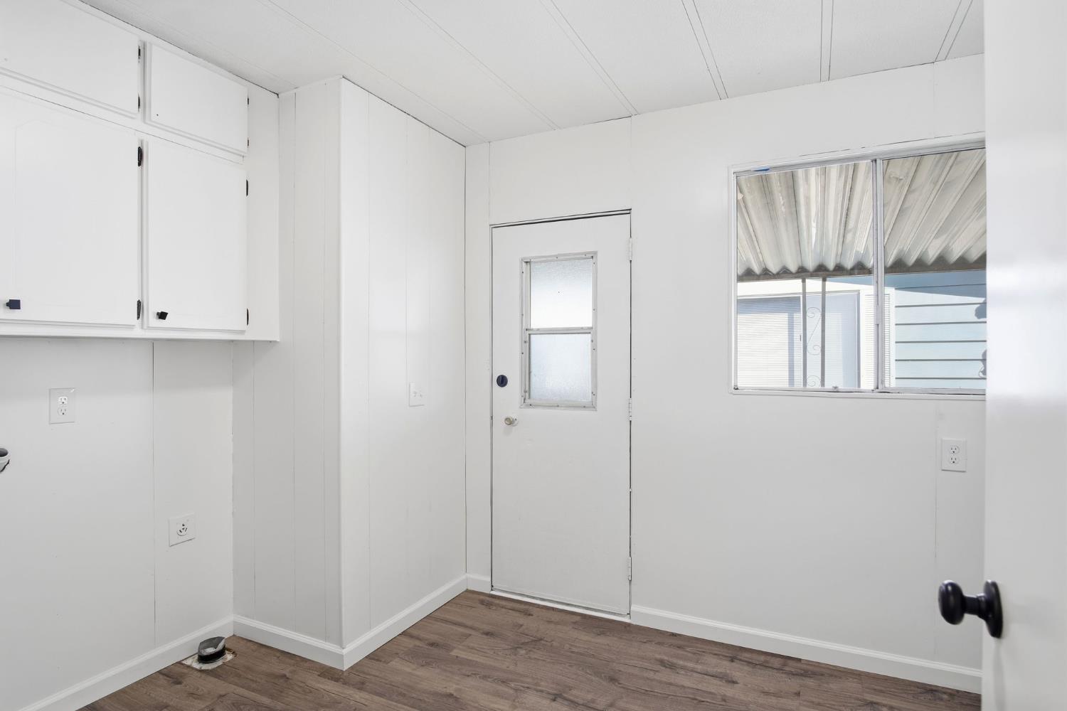 1200 South Carpenter Road, Unit 10 Modesto, CA 95351 - Photo 14 of 27 a view of room with window and wooden floor
