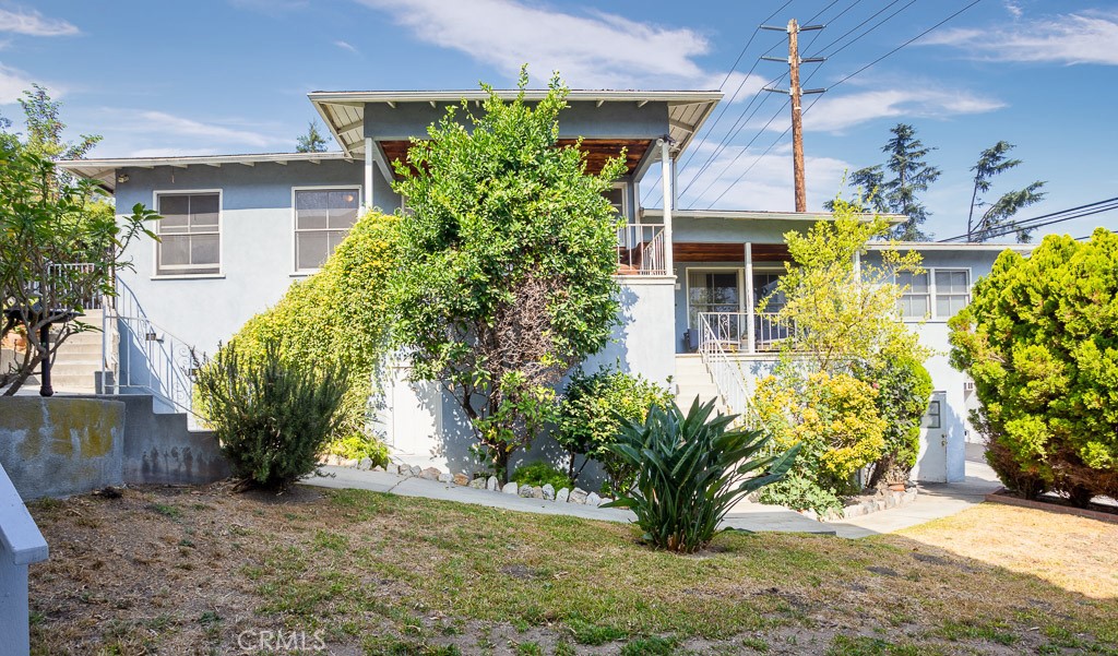 3735 Arbolada Road Los Angeles, CA 90027 - Photo 1 of 61 a front view of a house with garden