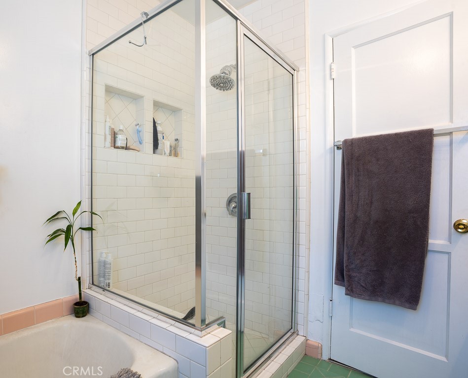 3735 Arbolada Road Los Angeles, CA 90027 - Photo 23 of 61 a bathroom with a shower and a mirror