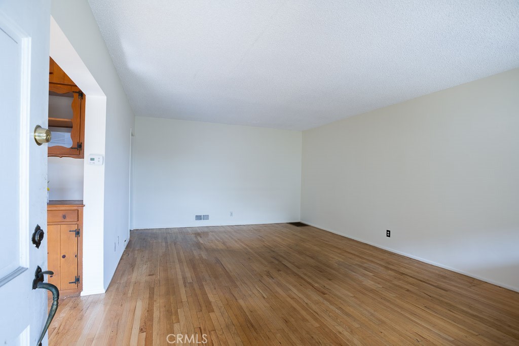 3735 Arbolada Road Los Angeles, CA 90027 - Photo 29 of 61 a view of a room with wooden floor and a window