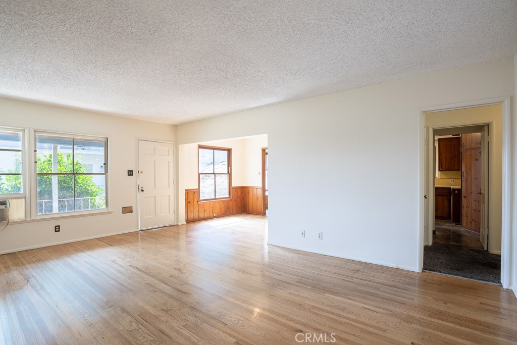 3735 Arbolada Road Los Angeles, CA 90027 - Photo 31 of 61 a view of an empty room with wooden floor and a window