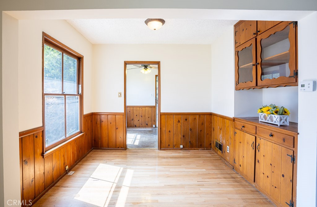3735 Arbolada Road Los Angeles, CA 90027 - Photo 33 of 61 a view of a hallway with wooden floor and furniture