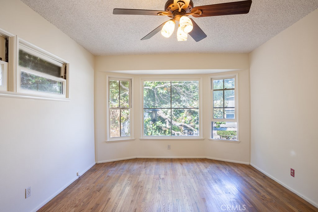 3735 Arbolada Road Los Angeles, CA 90027 - Photo 42 of 61 a view of an empty room with wooden floor and window