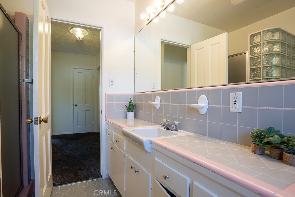 3735 Arbolada Road Los Angeles, CA 90027 - Photo 45 of 61 a bathroom with a sink and a mirror