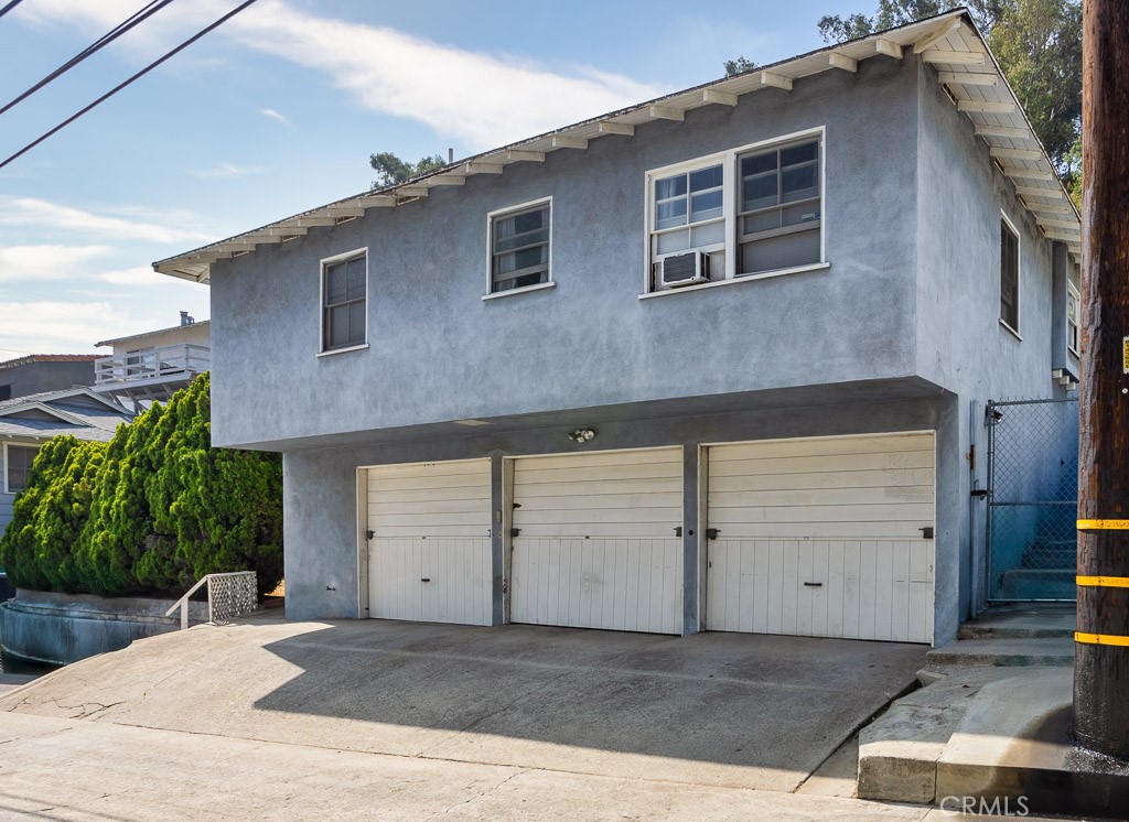 3735 Arbolada Road Los Angeles, CA 90027 - Photo 53 of 61 a front view of a house with garage