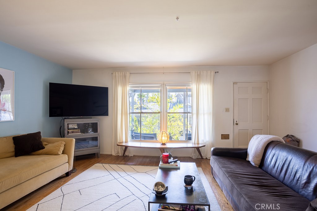 3735 Arbolada Road Los Angeles, CA 90027 - Photo 7 of 61 a living room with furniture and a flat screen tv