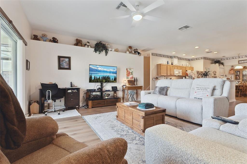 1209 Castleport Road Winter Garden, FL 34787 - Photo 11 of 36 a living room with furniture kitchen view and a large window