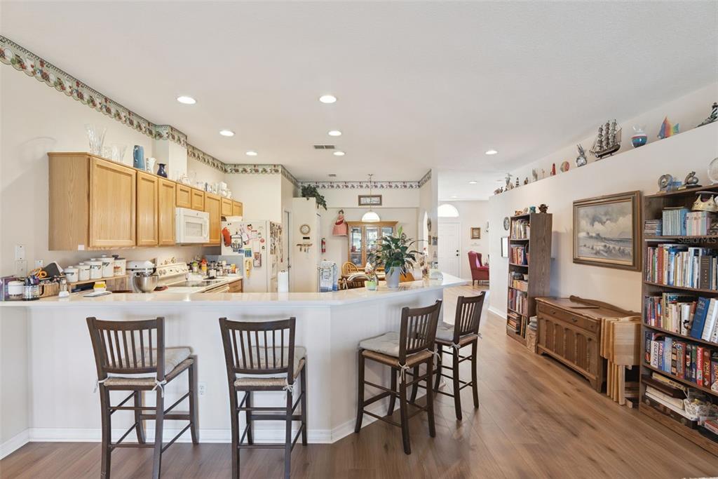 1209 Castleport Road Winter Garden, FL 34787 - Photo 14 of 36 a view of a dining room with furniture and a book shelf