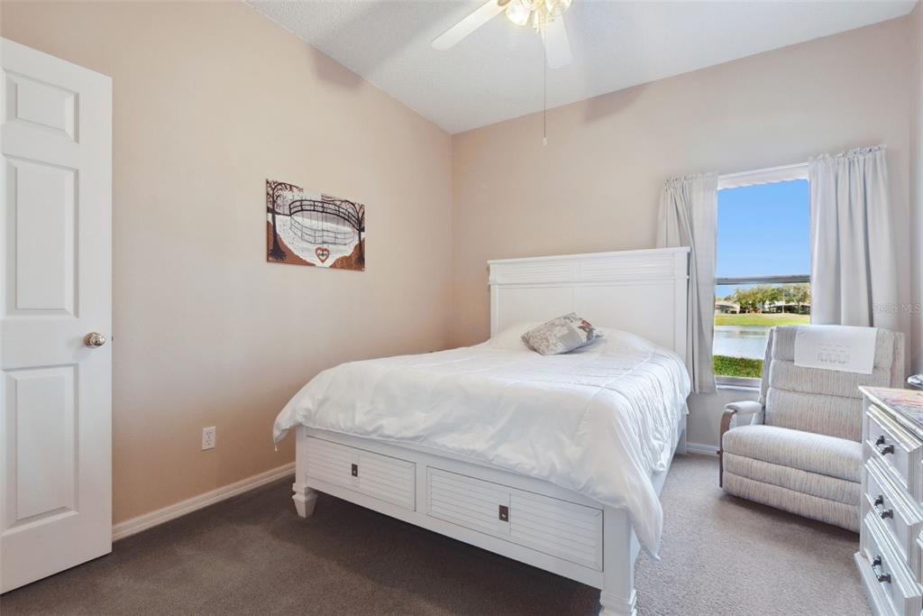 1209 Castleport Road Winter Garden, FL 34787 - Photo 18 of 36 a bedroom with a bed and a couch