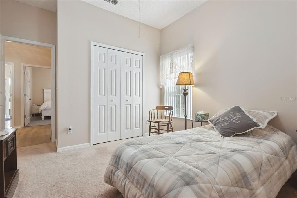 1209 Castleport Road Winter Garden, FL 34787 - Photo 19 of 36 a bedroom with a bed and a lamp