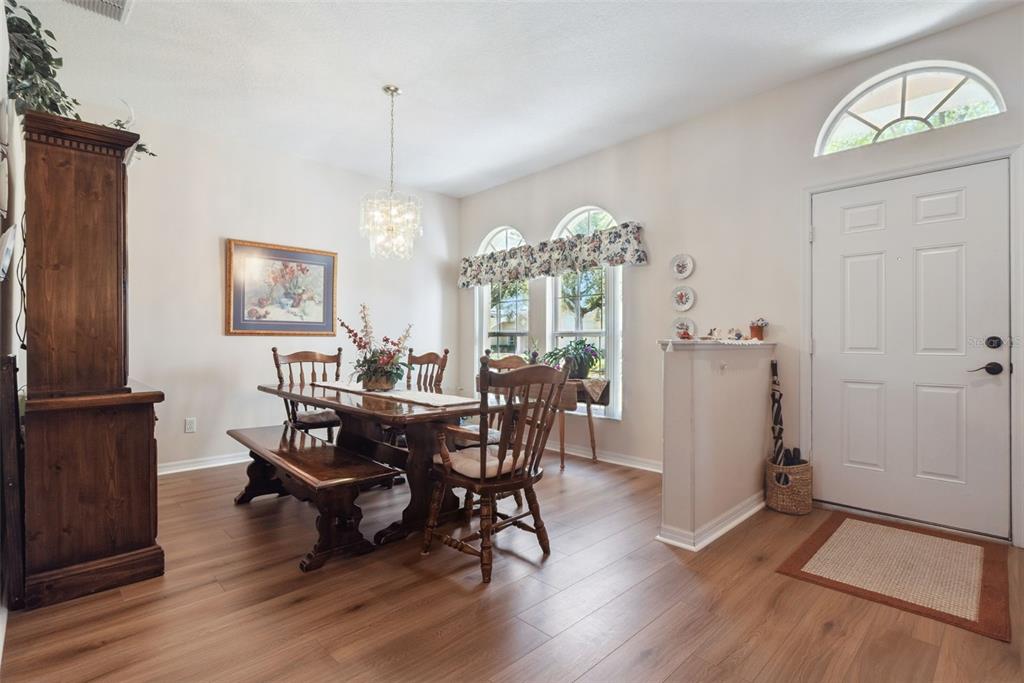 1209 Castleport Road Winter Garden, FL 34787 - Photo 4 of 36 a view of a dining room with furniture window and wooden floor