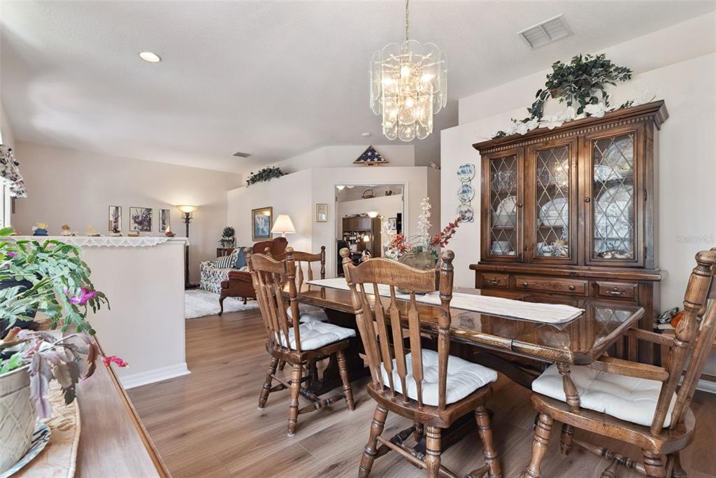 1209 Castleport Road Winter Garden, FL 34787 - Photo 6 of 36 a view of a dining room with furniture window and wooden floor