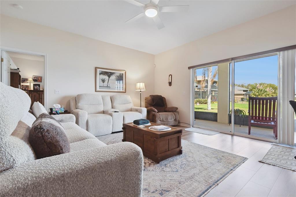 1209 Castleport Road Winter Garden, FL 34787 - Photo 10 of 36 a living room with furniture and a flat screen tv