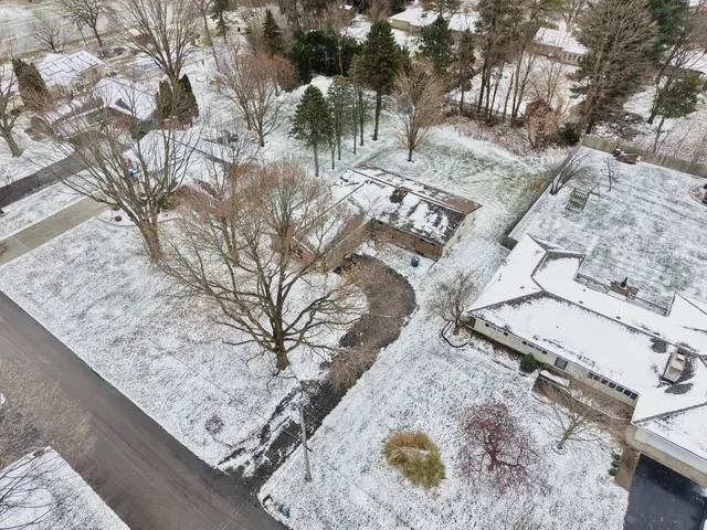 a view of a backyard with wooden fence