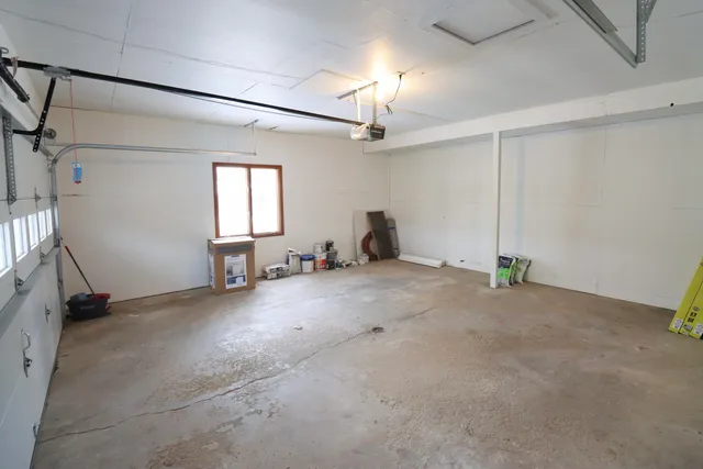 a view of a livingroom with furniture and a window