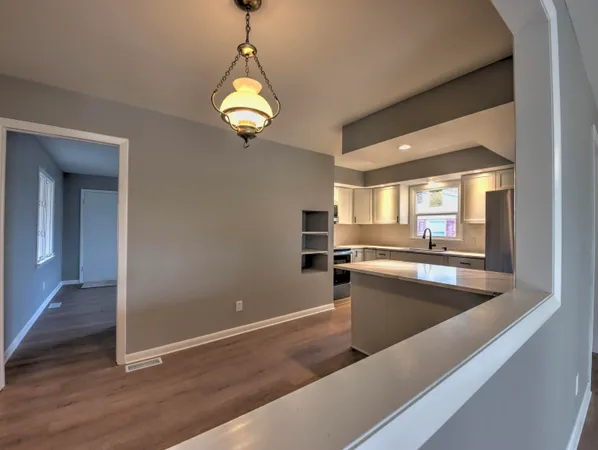 a kitchen with a sink and a window