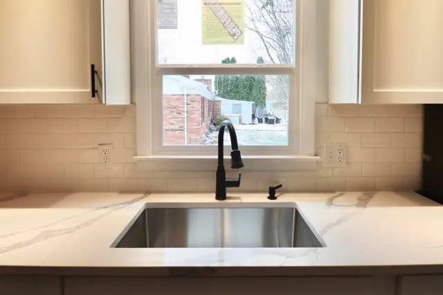 a kitchen with a sink and a window