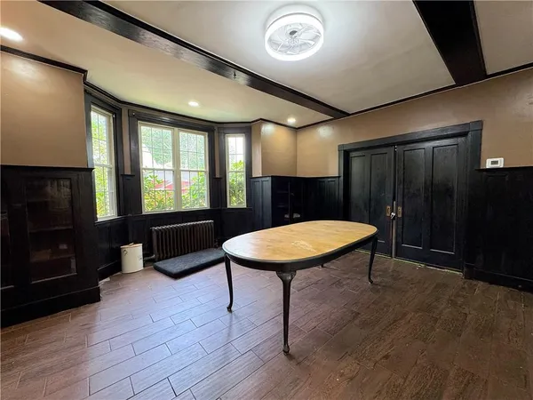 a view of a room with furniture window and wooden floor