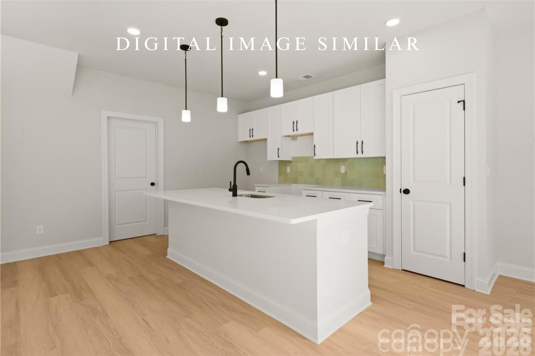 2928 Mulberry Church Road Charlotte, NC 28208 - Photo 32 of 43 a view of a kitchen with a sink and chandelier