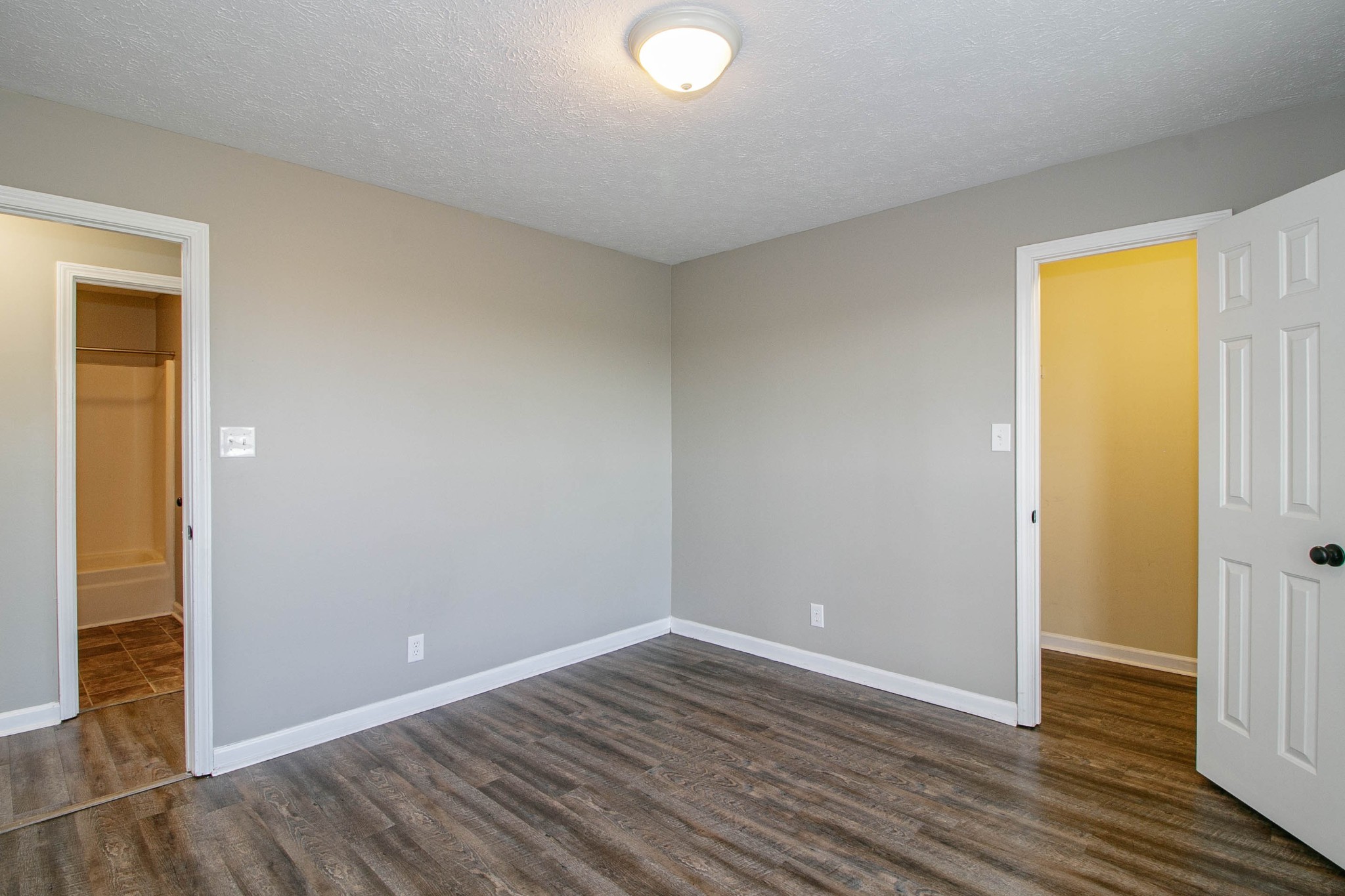 947 State Line Road Oak Grove, KY 42262 - Photo 13 of 25 a view of an empty room with wooden floor and a window