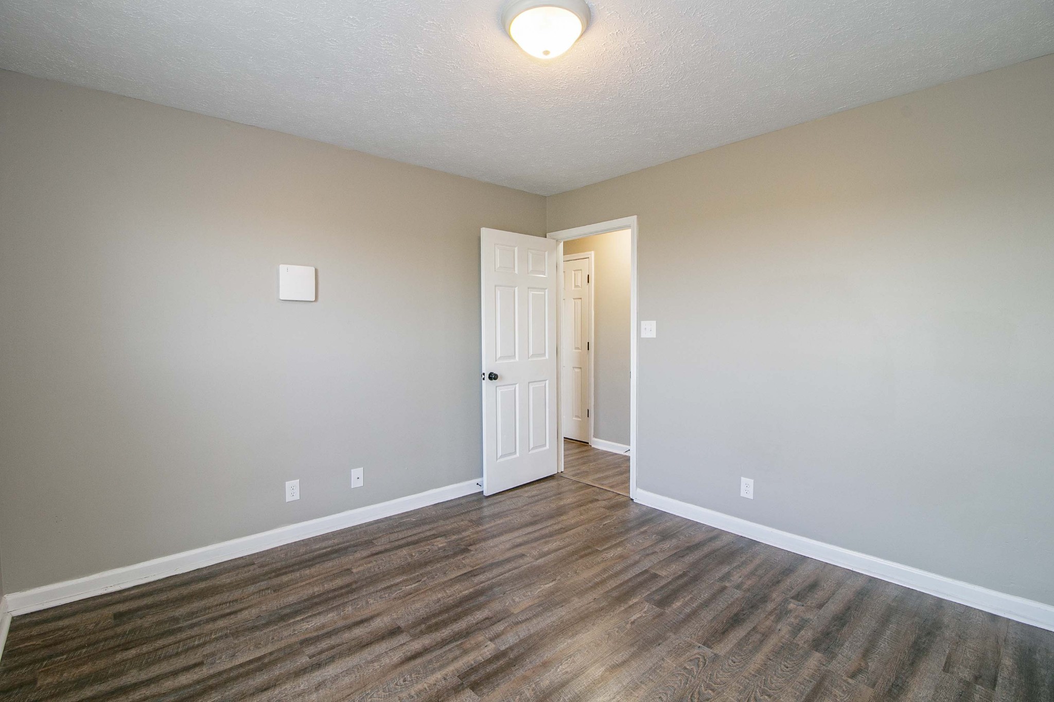 947 State Line Road Oak Grove, KY 42262 - Photo 14 of 25 a view of an empty room with wooden floor