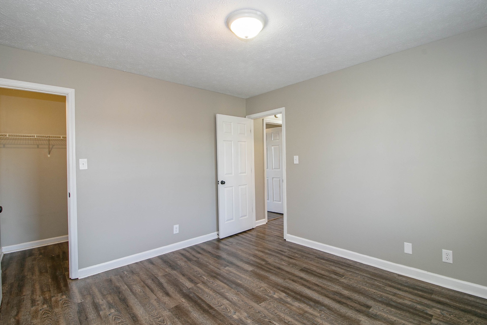 947 State Line Road Oak Grove, KY 42262 - Photo 18 of 25 a view of an empty room with wooden floor and closet
