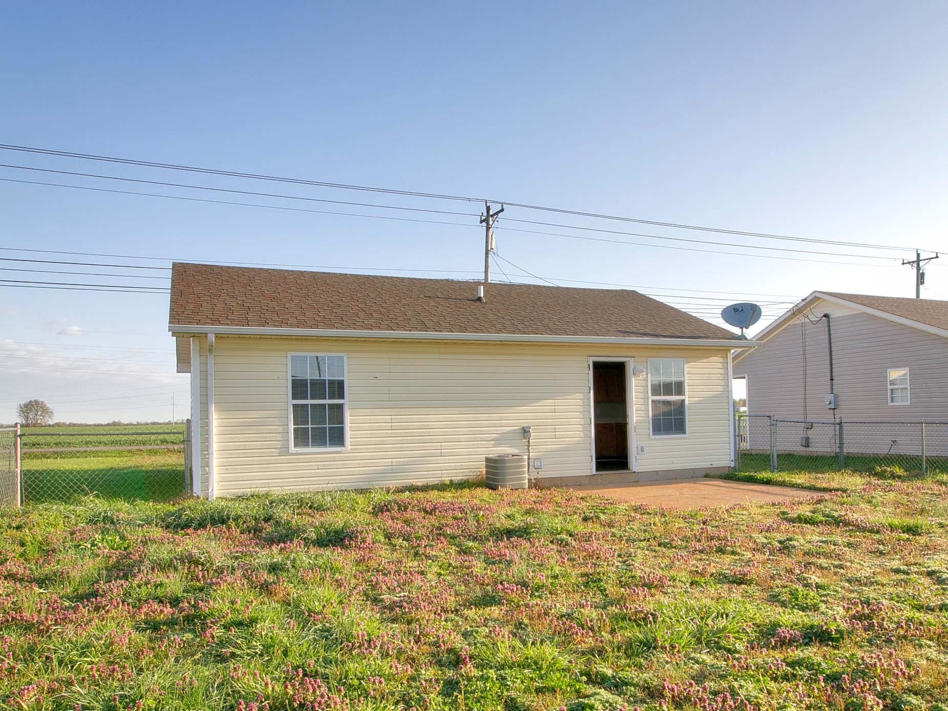 947 State Line Road Oak Grove, KY 42262 - Photo 23 of 25 a front view of a house with a yard