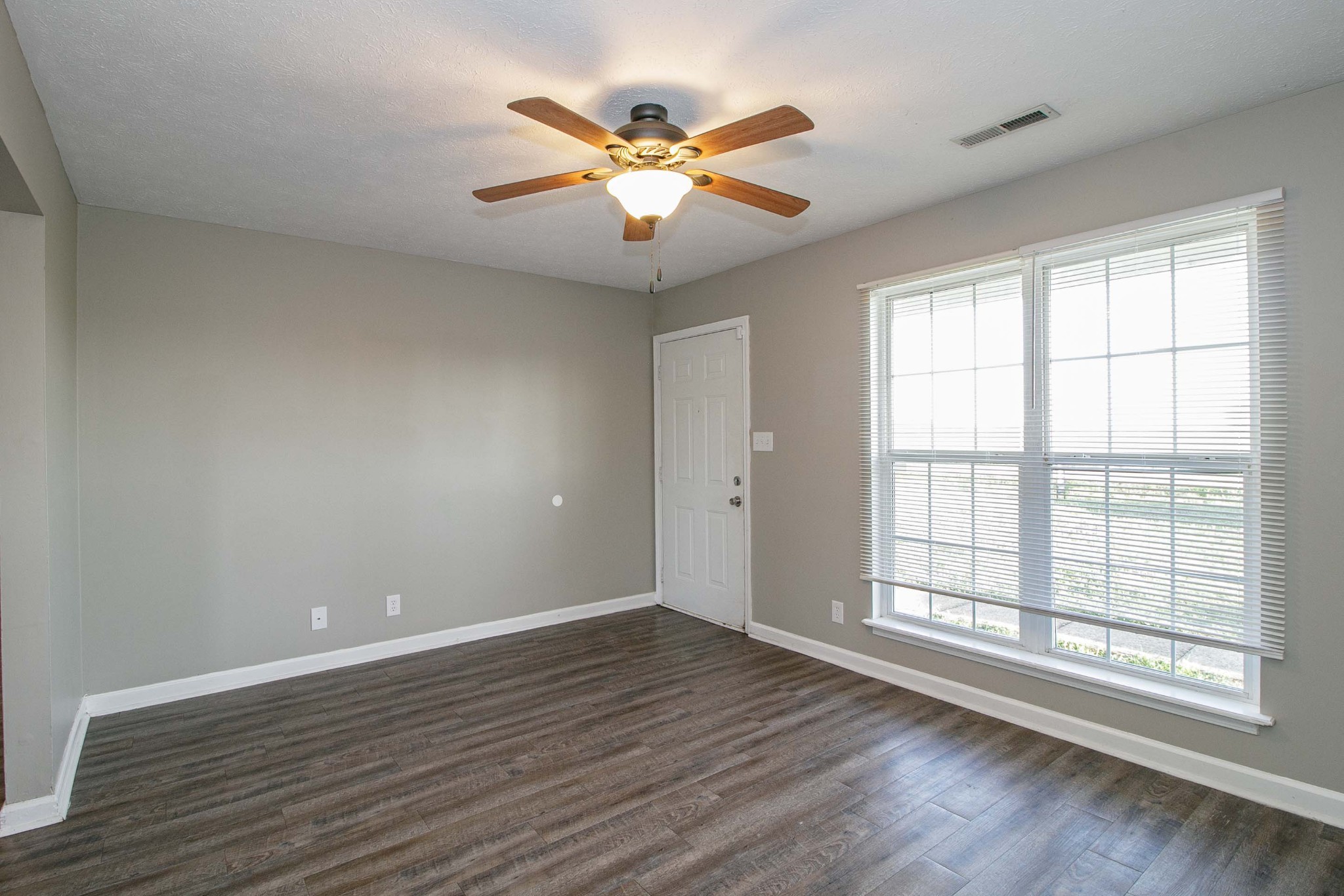 947 State Line Road Oak Grove, KY 42262 - Photo 4 of 25 wooden floor in an empty room with a window
